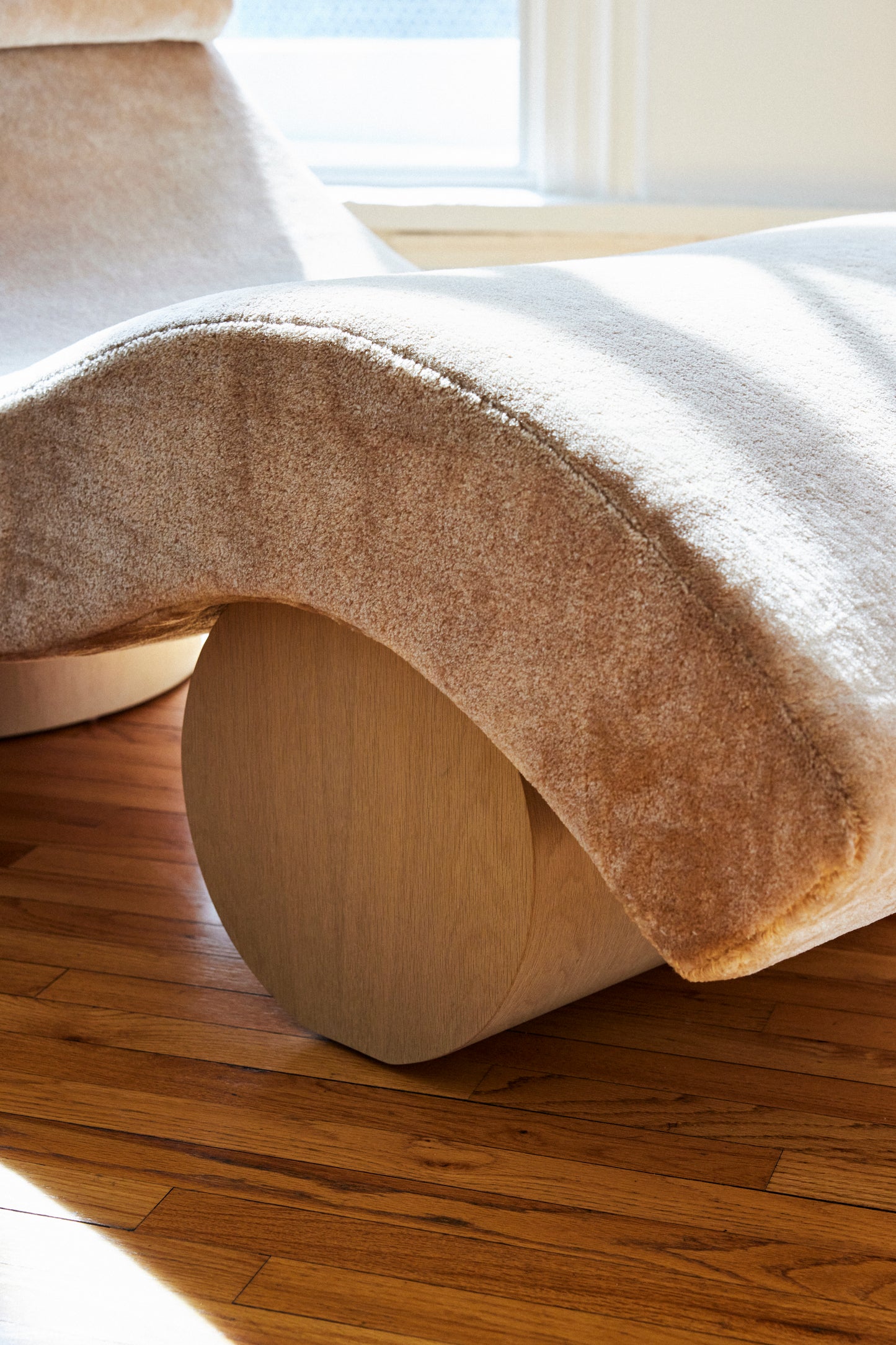Shown in Natural Oak base with fabric from Dedar