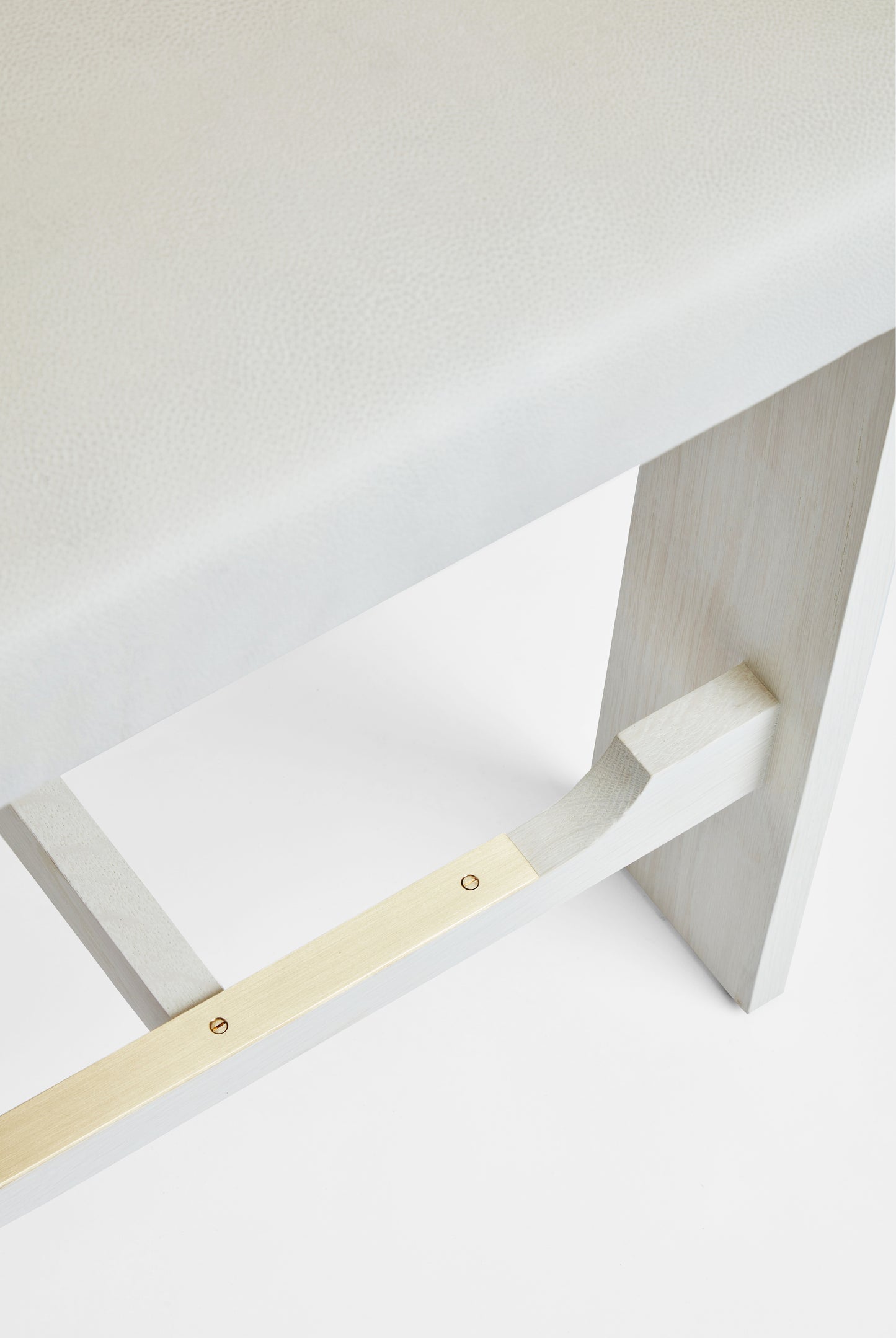 Shown in Bleached Oak frame with Unlacquered Brass foot rest
