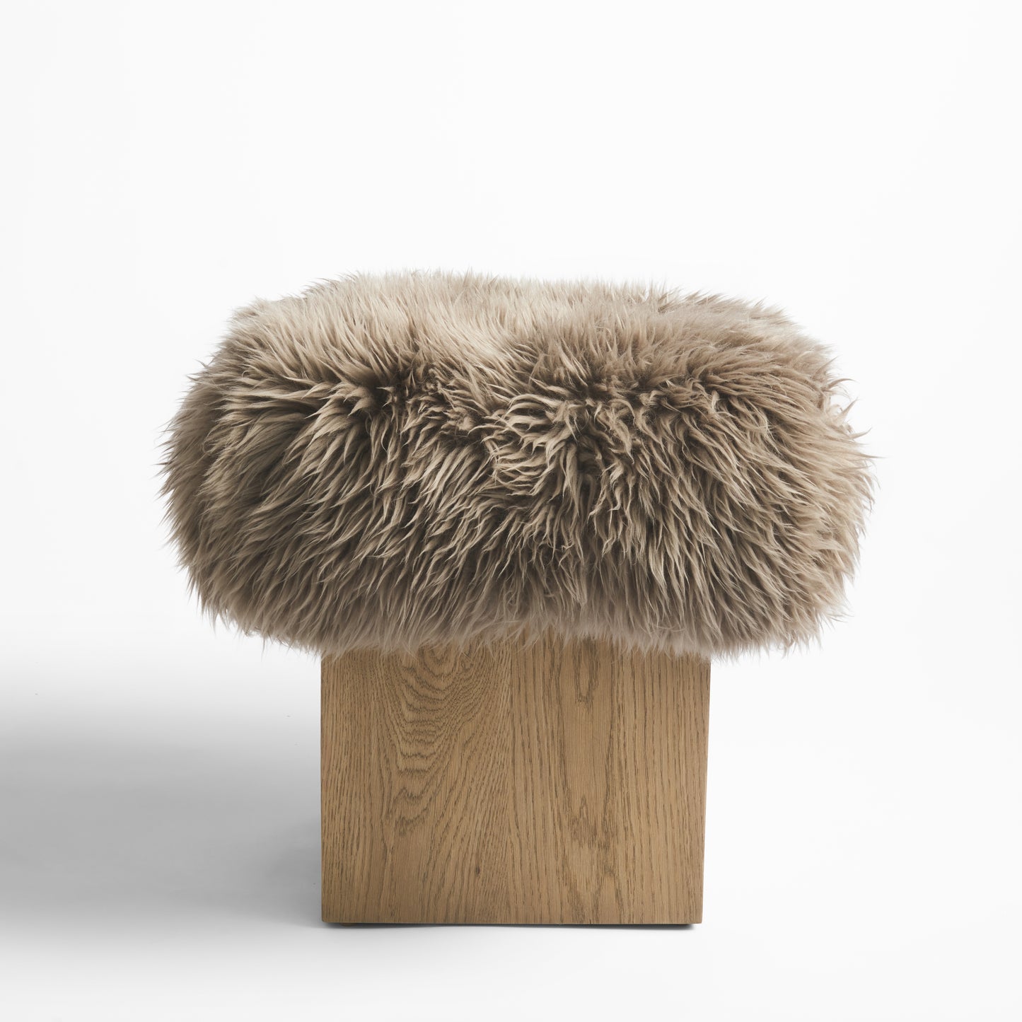 Shown in Wire Brushed Natural Oak finish with Portobello Lambskin cushion