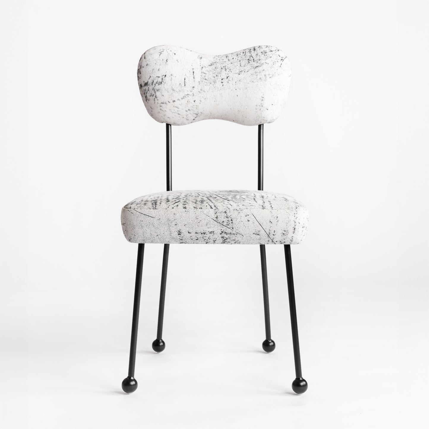 Shown in Solid steel in Black satin finish and upholstered in leather